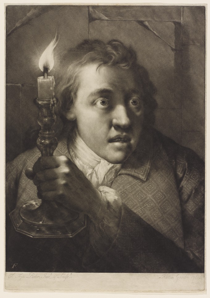 Young Man holding a Candle