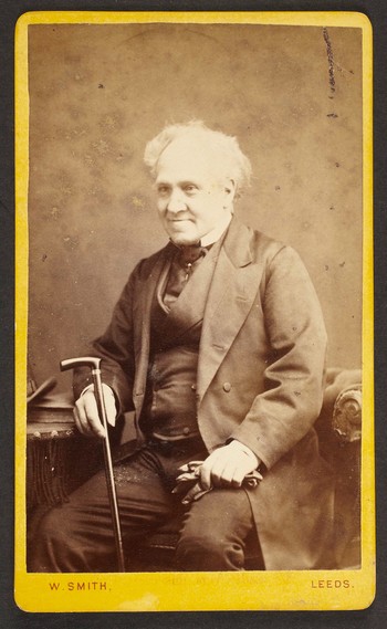 Unknown sitter [portrait of a seated elderly man with a walking stick and gloves]