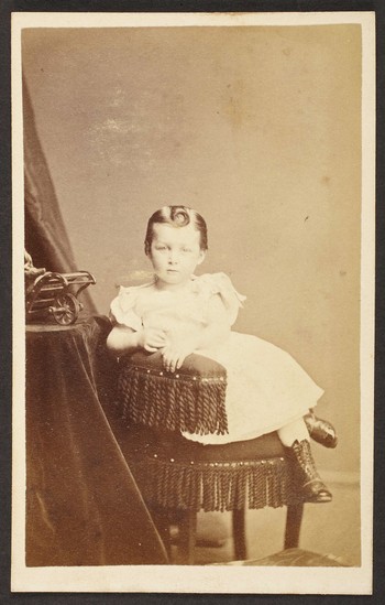 Unknown sitter [portrait of a seated child with a curl hair on forehead]