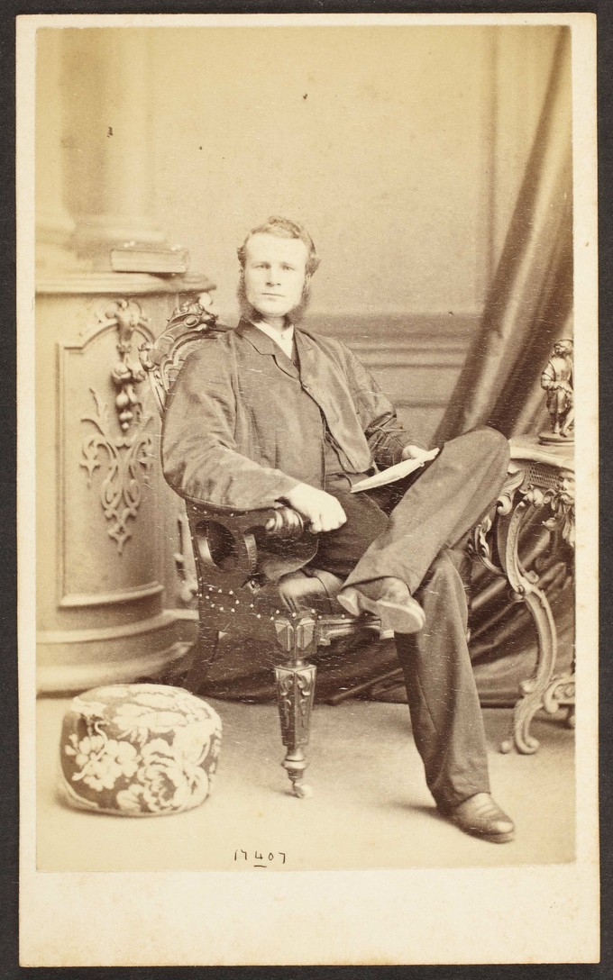 Unknown sitter [portrait of a seated man with a open book]