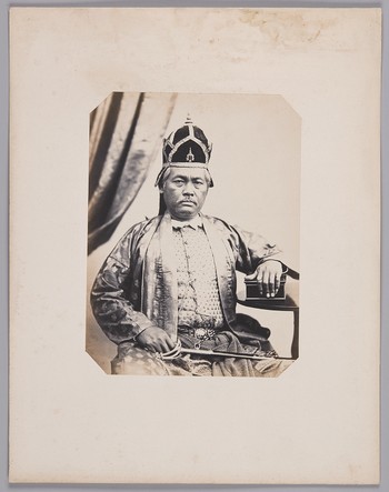 63. Hluang Indrinontay (46 years old) Chief Officer for municipal tax collection for the city of Bangkok, serving H.M. the first King of Siam; responsible for the Royal gifts sent to H.M. the Emperor of France. In full dress. born in Bangkok (Siam, now T