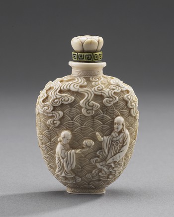 Snuff Bottle, with carved Daoists, elephant and foo dog
