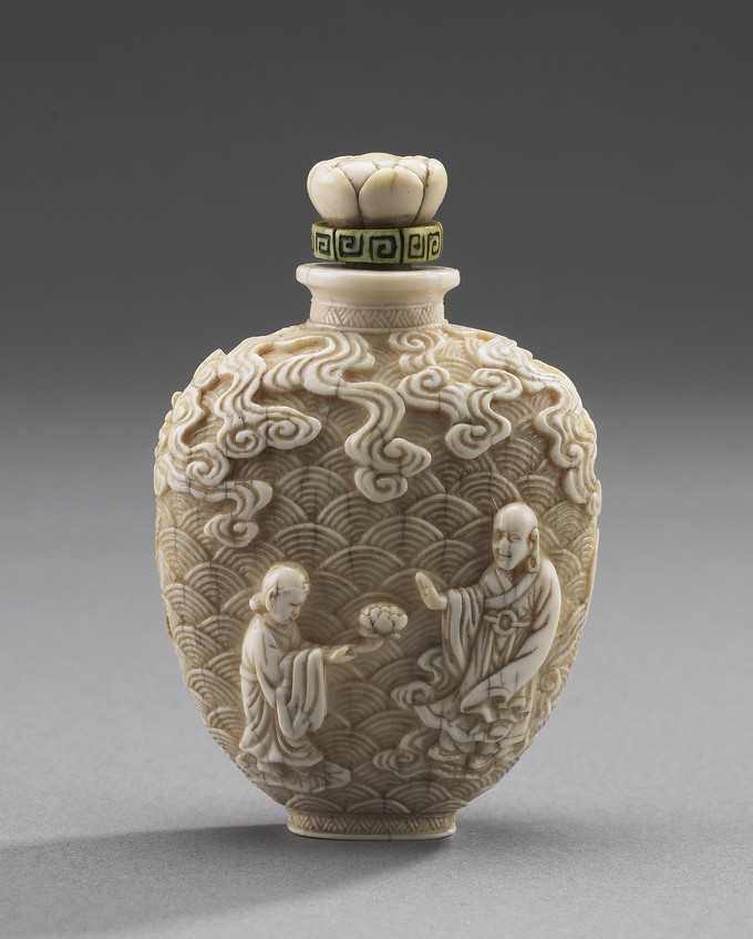 Snuff Bottle, with carved Daoists, elephant and foo dog